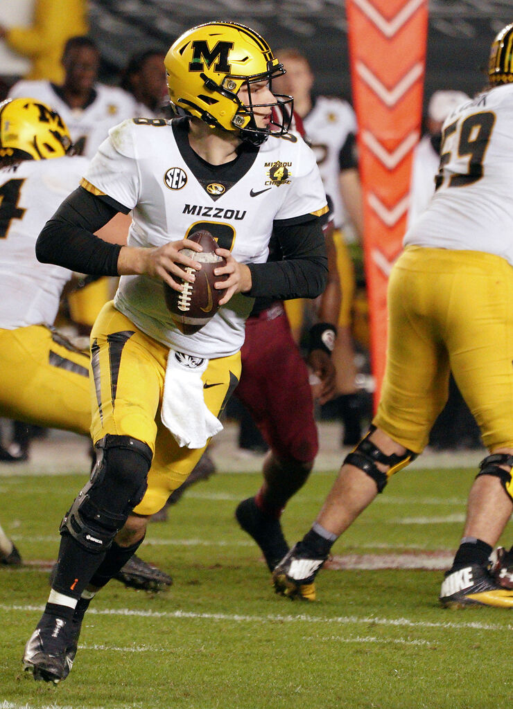 Connor Bazelak looks for an open receiver
